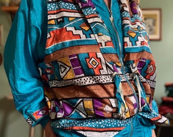 Vintage 80s 90s turquoise Southwestern Aztec Navajo print Windbreaker with tassels by Lavon