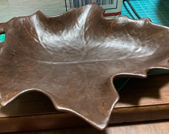 Ceramic maple leaf candy dish looks like wood.