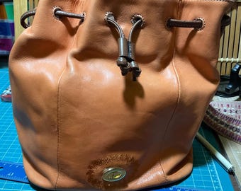 Tignanello bucket drawstring crossbody purse- orange