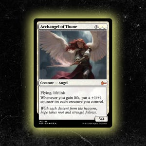 May include: A Magic: The Gathering card featuring the "Archangel of Thune." The card depicts an angel with white wings, holding a sword, and wearing armor. The card text describes the creature's abilities and stats, with a power and toughness of 3/4.