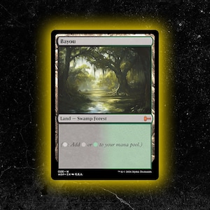 May include: A Magic: The Gathering card titled "Bayou." The card features a swamp forest scene with lush trees and a body of water. The card is labeled "Land - Swamp Forest" and includes text about adding mana to a pool.