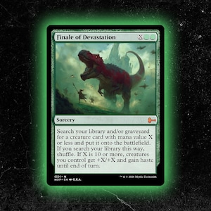 May include: A green Magic: The Gathering card titled "Finale of Devastation" featuring a red and grey dinosaur in a misty landscape. The card is a sorcery with text describing its effects. The card has a green border and a black background.