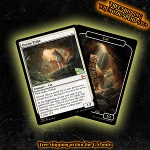 May include: Two rectangular trading cards featuring fantasy artwork. The left card is titled Ocelot Pride, showing spotted cats in a cave. The right card is titled Cat, showing a single spotted cat looking up at light streaming into a rocky cavern.
