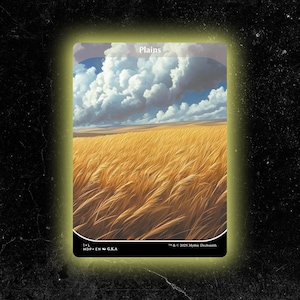 May include: A card with a landscape illustration of a golden wheat field under a cloudy sky. The word "Plains" is at the top. The bottom of the card has text including "1 L", "MDP EN G.K.A", and a copyright notice.