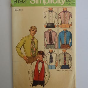 May include: Vintage Simplicity sewing pattern envelope. The cover features illustrations of men's shirts and ties, with a retro design. The pattern number is 9192, and it is marked as one size. The envelope is in shades of beige, green, and white.