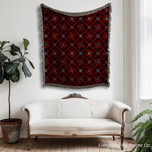 tatreez woven blanket, Palestinian throw blanket, Zahra tatreez blanket, cotton tatreez throw, traditional Palestinian textile, boho woven blanket, fringe cotton throw, cultural couch blanket, Middle Eastern decor, Palestinian heritage gift, bohemian tatreez blanket, tatreez home decor, handmade look blanket, cotton ethnic throw, Arabic design blanket, sofa throw Palestinian, folk art woven blanket, tatreez inspired decor, Palestinian cotton tapestry, artisanal couch throw