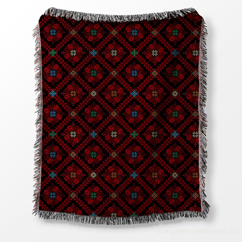 tatreez woven blanket, Palestinian throw blanket, Zahra tatreez blanket, cotton tatreez throw, traditional Palestinian textile, boho woven blanket, fringe cotton throw, cultural couch blanket, Middle Eastern decor, Palestinian heritage gift, bohemian tatreez blanket, tatreez home decor, handmade look blanket, cotton ethnic throw, Arabic design blanket, sofa throw Palestinian, folk art woven blanket, tatreez inspired decor, Palestinian cotton tapestry, artisanal couch throw