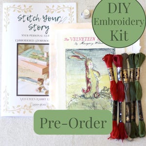 May include: A DIY embroidery kit featuring a book titled "Stitch Your Story" and a print of "The Velveteen Rabbit." The kit includes embroidery floss in red, green, and brown, a thimble, and a green circle with "DIY Embroidery Kit" text.