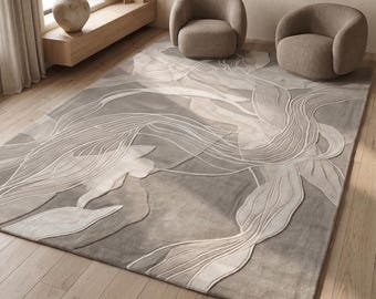 May include: A large, rectangular area rug with a floral design in shades of gray and white. The rug features a raised, textured pattern of stylized leaves and flowing lines. Two rounded armchairs sit on the rug.