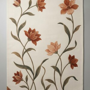 May include: A rectangular area rug with an off-white background featuring a floral pattern of terracotta and peach-colored flowers with sage green stems and leaves. The text @jemrugs is printed on a small brown tag in the bottom left corner.