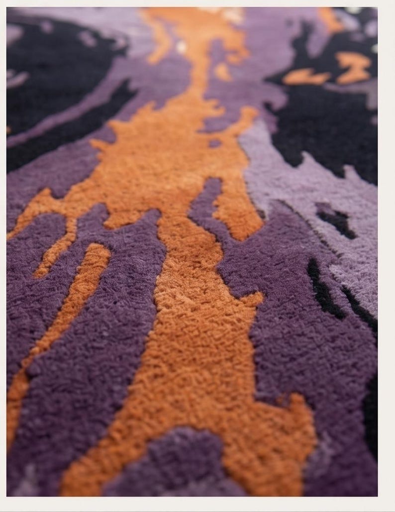 May include: A tufted rug featuring an abstract, organic pattern with deep black, vibrant orange, and various shades of purple. The surface has a thick, textured pile with distinct color-blocked shapes that flow across the entire area of the rug.