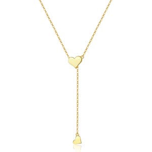 May include: A gold chain necklace with two heart-shaped pendants. The necklace is delicate and feminine.