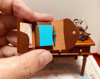 1/12 miniature leather diary holder with sections for diary, correspondence and pen, a beautiful piece as realistic as the 1/1