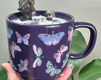 Stogie & Flask scented 12oz soy Candle in reusable butterfly ceramic mug. Fluorite Racoon, Howlite butterfly, Amethyst mushie. 60 hours