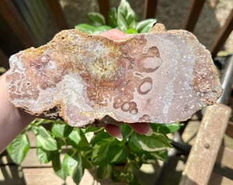 8 inch Pink Amethyst Slab. Natural edges. Calcite pocket. Display stand included