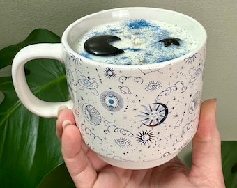 Saturn’s Spell scented 12oz soy Candle in reusable celestial ceramic mug. Black Obsidian Moon and star. 60 hours burn time.