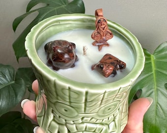 8oz Blackberry Sage scented soy candle in tree stump tiki cup. Mahogany Obsidian frogs and Peruvian clay troll with crystal. 40 hours burn