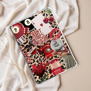 May include: A clear tablet case featuring a leopard print pattern and a collage of red and black graphics. The design includes a pool ball, playing cards, cherries, and the text "HOT GIRLS READ".