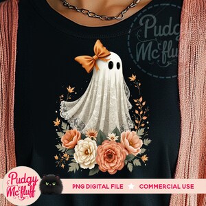 May include: A white ghost with a lace overlay and an orange bow is surrounded by fall-colored flowers. The ghost is wearing a bow and has a sweet expression. The background is black.