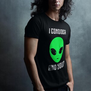 Consider Alien Graphic Tee | Cool UFO T-Shirt | Retro Sci-Fi Apparel Unisex Jersey Short Sleeve Tee