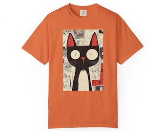May include: Orange t-shirt featuring a cartoon cat illustration. The cat is black with large white eyes, red ears, and a small pink nose. The cat is set against a background of various drawings and red accents.