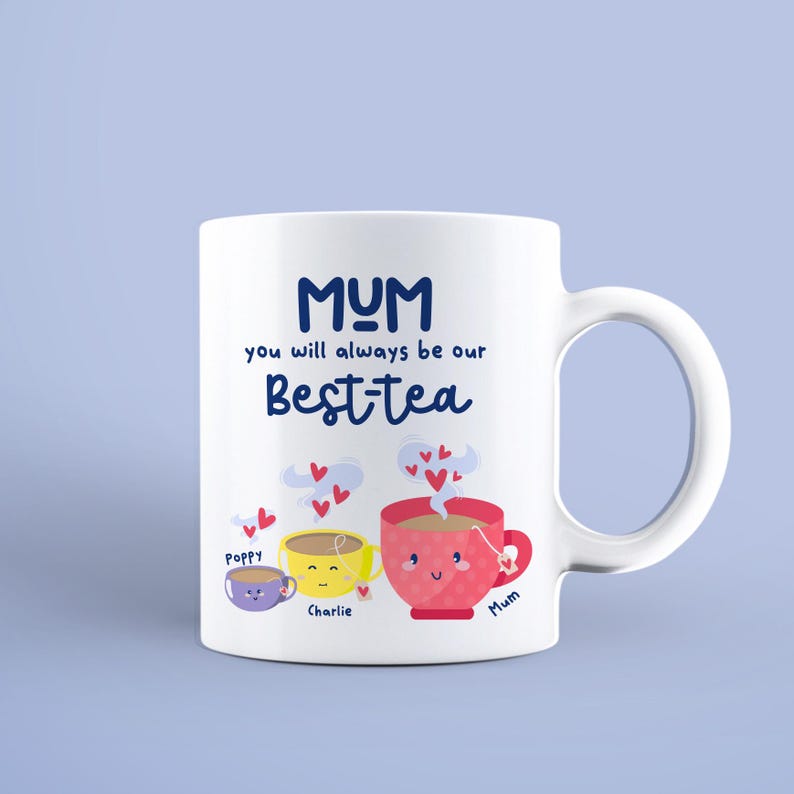 May include: White ceramic mug with a blue and white design. The mug says "MUM you will always be our Best-tea" with three cartoon teacups below. The teacups are labeled "Poppy", "Charlie", and "Mum".