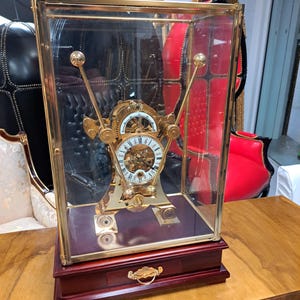 Antique style gold Harrison Grasshopper mantel skeelington clock (do not buy this item if you live outside the United Kingdom)