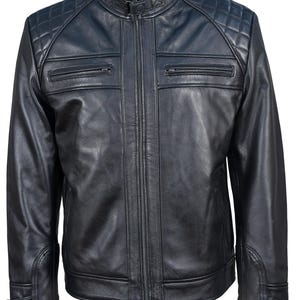 May include: A black leather jacket with a zipper closure and quilted shoulders. The jacket has two zippered pockets on the front and a stand-up collar.