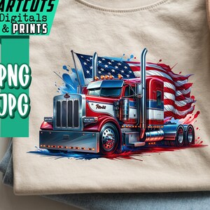 Könnte beinhalten: Beiges T-Shirt mit einem rot-weiß-blauen Grafikdesign eines Sattelschleppers mit amerikanischer Flagge. Das T-Shirt liegt gefaltet auf einer blauen Jeans. Ein beiger Hut ist ebenfalls zu sehen. Der Text "ARTCUTS DIGITALS & PRINTS" ist enthalten.