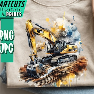 Puede incluir: Camiseta beige con una ilustración de acuarela de una excavadora CAT amarilla y negra. La camiseta está doblada sobre unos vaqueros azules. El texto "ARTCUTS Digitals & Prints" y "PNG JPG" está en el lado izquierdo de la camiseta.