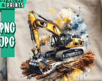 Puede incluir: Camiseta beige con una ilustración de acuarela de una excavadora CAT amarilla y negra. La camiseta está doblada sobre unos vaqueros azules. El texto "ARTCUTS Digitals & Prints" y "PNG JPG" está en el lado izquierdo de la camiseta.