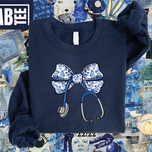 Coquette Stethoscope Nurse Sweatshirt, Toile Nurse Shirt, Nurse Bow Shirt, Coquette Nurse Shirt, Registered Nurse Shirt, Gift for Nurse Tee