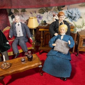 May include: A set of three ceramic mugs with a speckled, matte finish in cream, light grey, and dark grey. Each mug has a simple, minimalist design, suitable for coffee or tea.