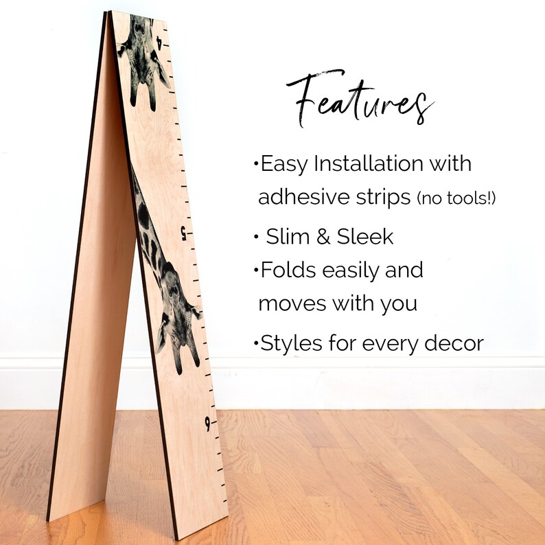 May include: A wooden height chart with a giraffe design. The chart features a ruler with markings and numbers, and the text "Features" and bullet points describing the product.