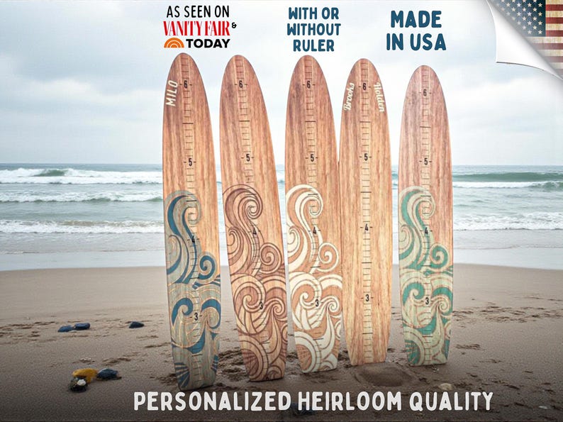 May include: Wooden growth charts with decorative wave designs and measurement markings. Each chart is personalized with a name and features the text "AS SEEN ON VANITY FAIR TODAY" and "MADE IN USA". The charts measure up to 6 feet.