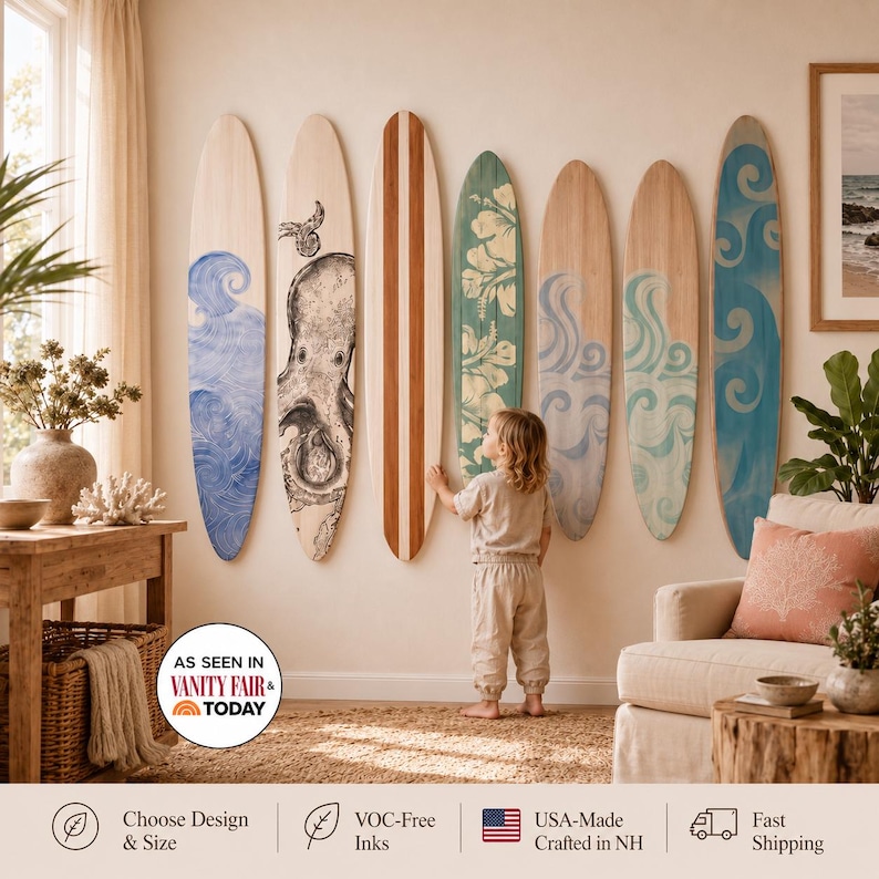 May include: Seven decorative wooden surfboards mounted on a wall, featuring various designs including blue waves, an octopus illustration, a central wood-grain stripe, a green hibiscus floral pattern, and swirling blue and teal wave motifs.