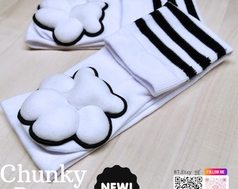 May include: White socks with a black and white cloud design. The socks have a cloud-shaped applique with a black outline. The top of the socks have black and white stripes. The text "Chunky Beans" is visible.