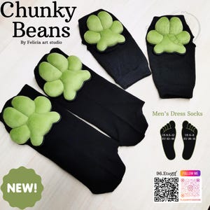 May include: Black dress socks with a lime green paw print design. The socks are labeled "Chunky Beans" and "Men's Dress Socks". The image also includes the text "NEW!" and size information for US and EU shoe sizes.