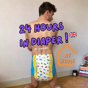 May include: A person wearing a colorful diaper with the text "24 HOURS IN DIAPER!" and "BY SURICATE" on it. The person is standing in front of a white wall with a house-shaped graphic that says "AT HOME" on it.