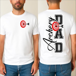 May include: White t-shirt featuring a red and black archery target graphic on the front. The back of the shirt displays the words "Archery DAD" in black, with a target graphic. The shirt is made of a soft material.