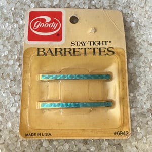 vintage barrettes , slender metal barrettes , slender barrette , gold tone ,blue holographic center , vintage Goody,