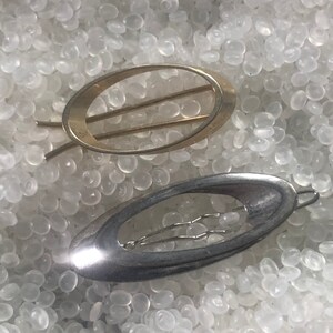 gold tone 1980s   vintage barrettes ,  open oval set of 2,  one gold tone, one silver tone,S5
