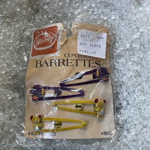 vintage barrettes .original card ,NOS, ,snap tight ,yellow bear , purple dogs , dated 1975, 1984 hair clips, 2 pairs , set of 2, bd4