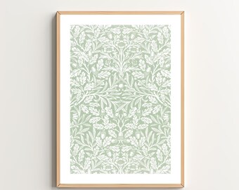 May include: A framed print featuring a white and green floral pattern. The design includes leaves, flowers, and acorns. The frame is a light wood colour.