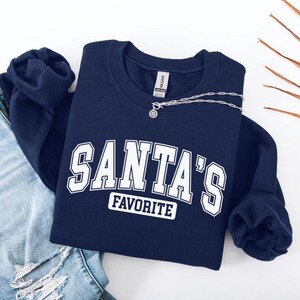 Santa&#39;s Favorite Sweatshirt & Tee - Funny Christmas Crewneck, Cozy Holiday Hoodie, Cute Winter Gift, Santa Lover Shirt, Christmas Gift Idea