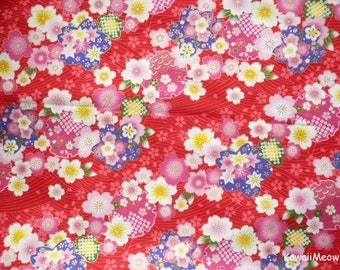 May include: Red fabric with a floral pattern featuring pink, white, and yellow flowers. The background is a red wave pattern.