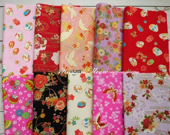 May include: A collection of 10 fabric squares with various Japanese-inspired patterns. The fabrics feature pink, red, white, black, and gold colors. The patterns include flowers, birds, butterflies, and geometric designs.