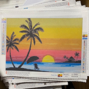 May include: A diamond painting kit featuring a tropical sunset scene. The image shows palm trees, a beach chair, and a sun setting over the ocean. The kit is 40cm x 30cm and includes a color list and model number LS-20063.