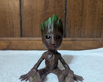 Hand-Painted Sitting Baby Tree Figurine Superhero Figure