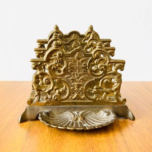 Vintage brass letter holder, with two racks and a shell shaped tray. This stylish item is in great vintage condition